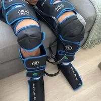 Air-C Compression Massager customer photo shared by reviewer using the device on their calf