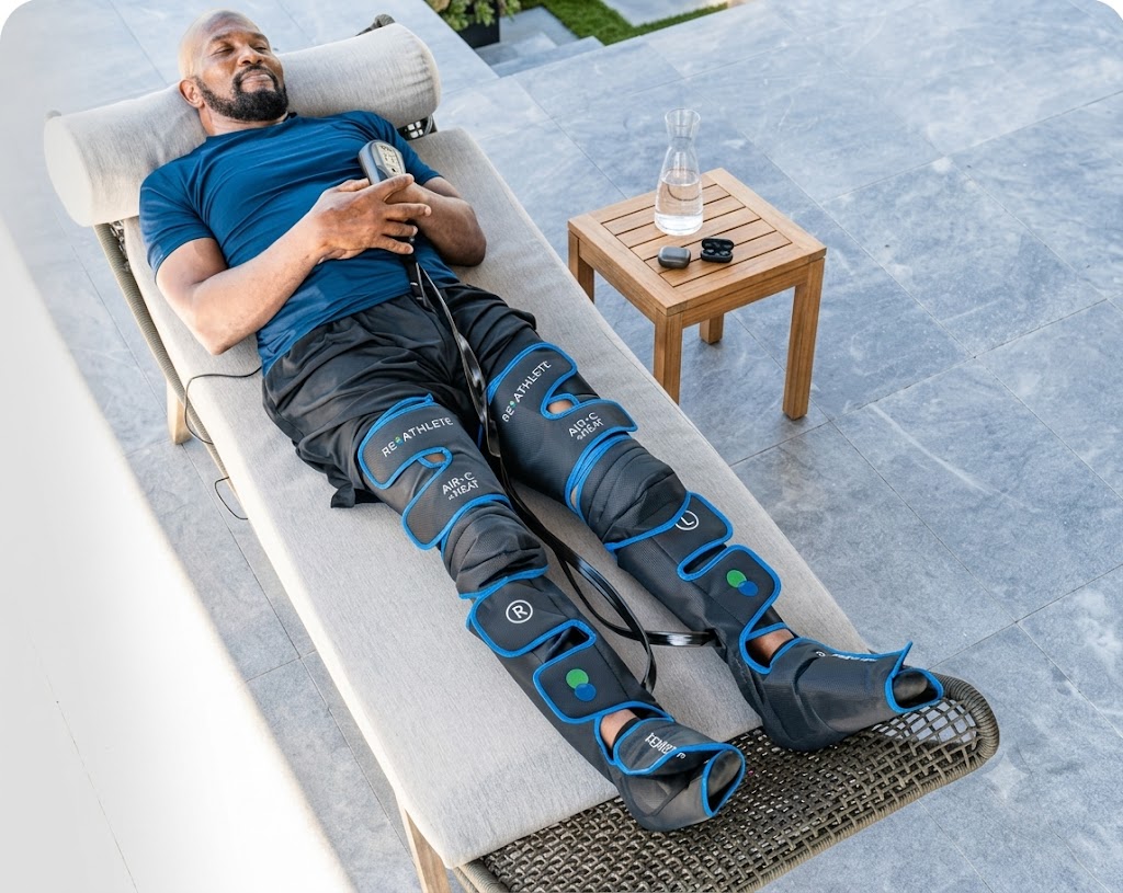 Person using the Air-C Compression Massager with heat setting on the calf